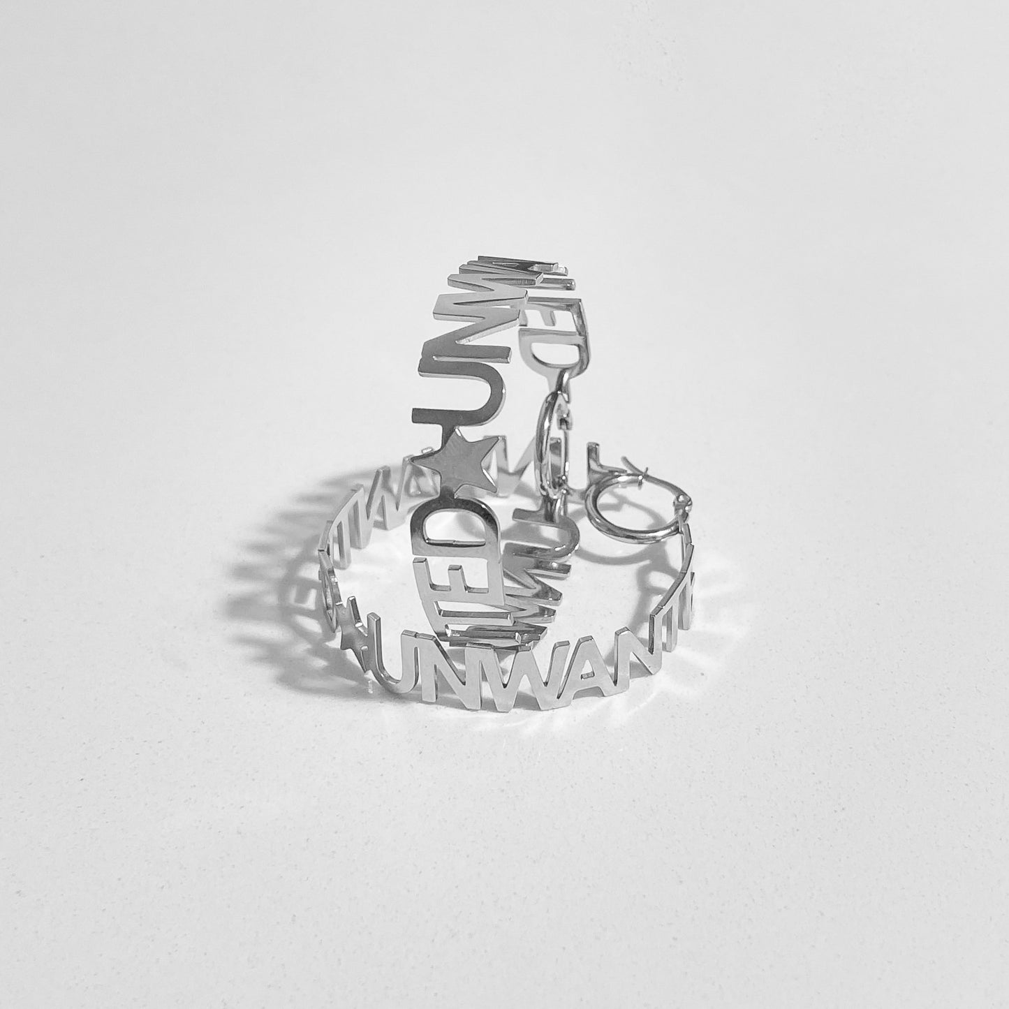 “UNWANTED” HOOP EARRiNGS