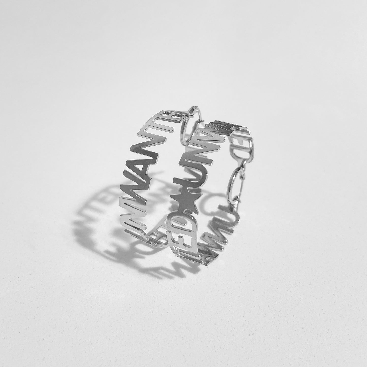 “UNWANTED” HOOP EARRiNGS