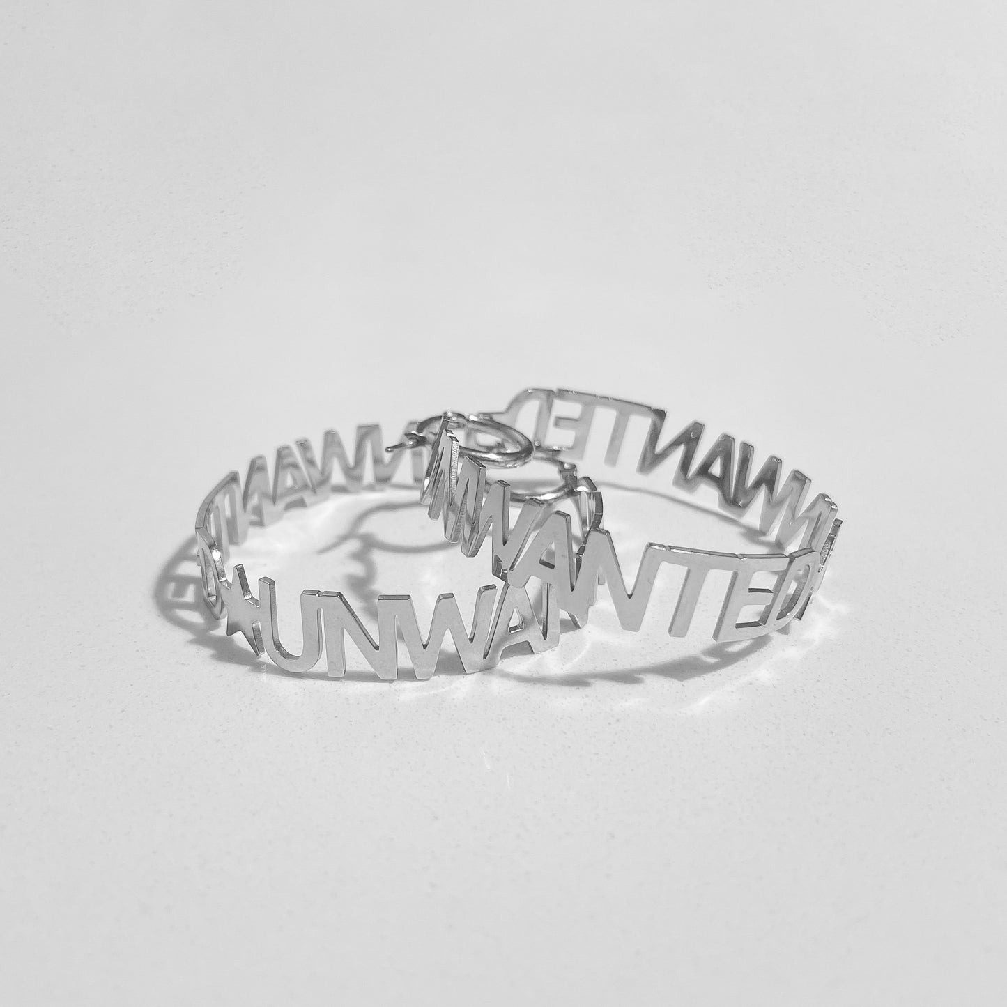 “UNWANTED” HOOP EARRiNGS